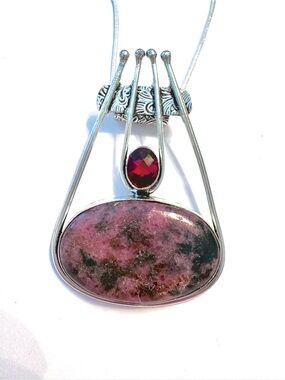 2 1/4 inch, 925 marked, Rhodonite and Garnet pendant on a silver chain.